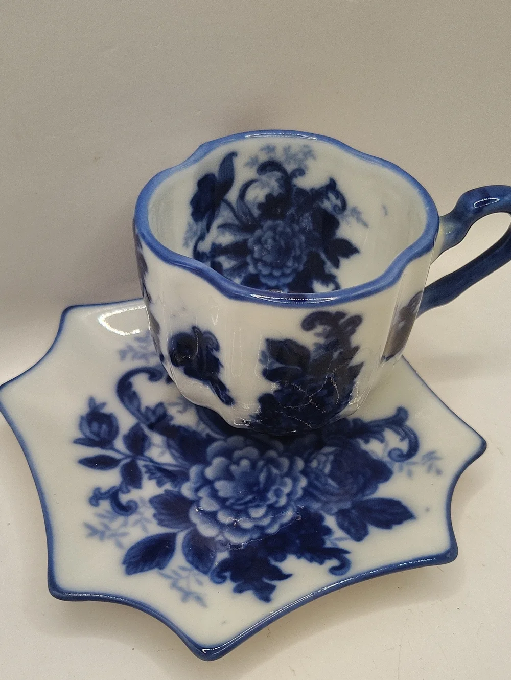 Blue and White Floral Porcelain Teacup with Matching Saucer